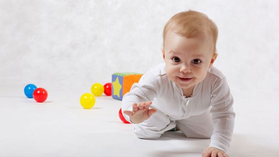 A baby crawling.