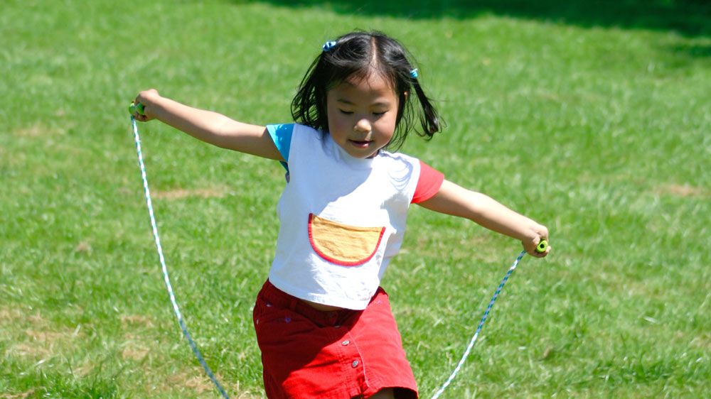 A girl skipping.