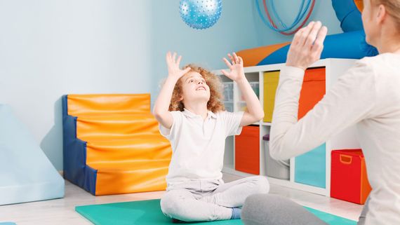 A child participating in movement therapy.