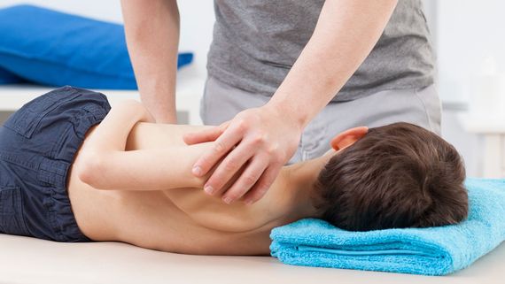 A child receiving physiotherapy treatment.