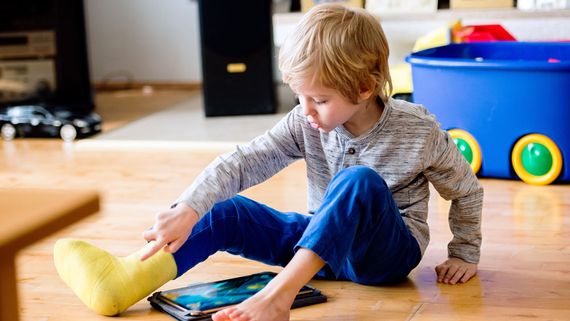 A child wearing a cast.